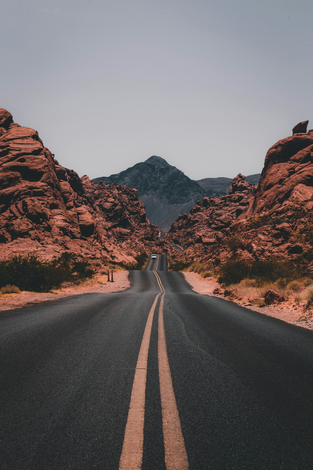 Open road through dramatic mountains
